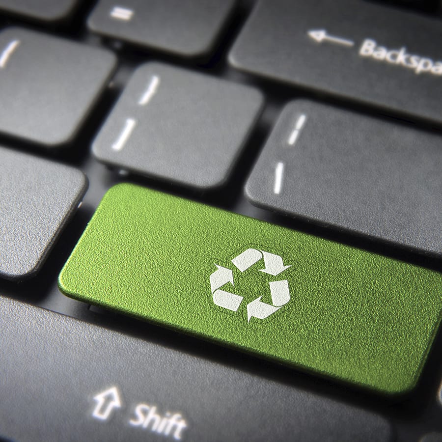 go green key with recycle icon symbol on laptop keyboard